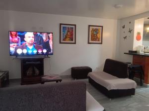 Телевизор и/или развлекательный центр в Home Sweet Home Paipa