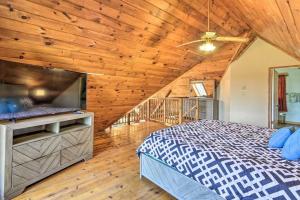 a bedroom with a bed and a flat screen tv at Premium 4Br Cabin Closest To Elk Ski, Nyc, Philly Free Wifi - The Log Cabin in Pleasant Mount +35 photos