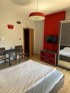 A bed or beds in a room at Guest House Elegance