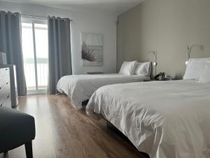 Postel nebo postele na pokoji v ubytování Hôtel Normandie