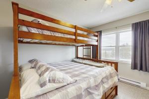 a bedroom with two bunk beds and a window at The Bear's Den in Rockwood