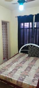 Postel nebo postele na pokoji v ubytování Casa com suíte, WiFi e churrasqueira perto da praia + 21 fotografií