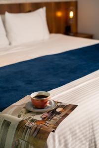 Voodi või voodid majutusasutuse Cafe Hotel Medellín toas