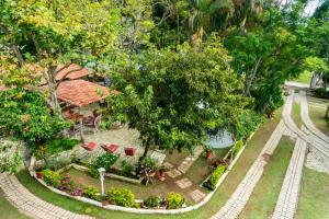 an aerial view of a house with a garden at Pousada Calu in Cunha
