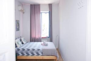 Postel nebo postele na pokoji v ubytování Cloud9 Apartments