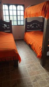 Ένα ή περισσότερα κρεβάτια σε δωμάτιο στο Finca Hotel Casa Grande