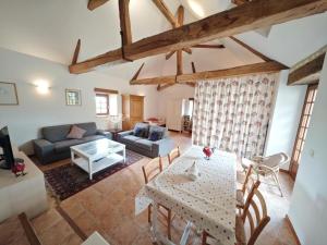 a living room with a table and a couch at Charmante demeure 17e avec piscine privative, grand jardin et patrimoine riche en Touraine Sud. - FR-1-381-368 in Abilly-Sur-Claise