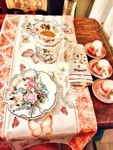 a table with a table cloth with butterflies on it at bb Margherita seaside, 20 minutes from the Cinque Terre by train in Moneglia +25 photos