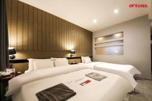 Postel nebo postele na pokoji v ubytování Hotel Yaja Terminal Branch