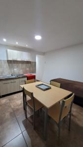 a kitchen with a table and chairs in a room at Depto por día in San Luis +26 photos