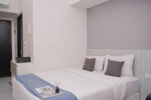Postel nebo postele na pokoji v ubytování Elegant Studio at Casa De Parco Apartment By Travelio + 13 fotografií