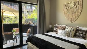 a bedroom with a bed and a sliding glass door at Private Pool Apartment in Tulum Hotel Zone - Beach Club in Tulum +105 photos