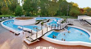 a group of people in a swimming pool at Gästehaus Leithen in Bad Birnbach