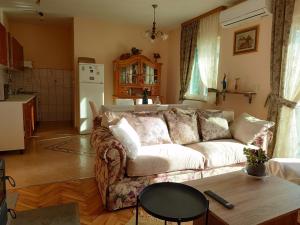 a living room with a couch and a table at Apartment in Ra anac near Beach Rtina in Ražanac