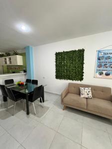 a living room with a couch and a table at Apartamentos Mila in Guayabal