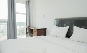 Ένα ή περισσότερα κρεβάτια σε δωμάτιο στο Cozy Studio at Amazana Serpong Apartment By Travelio +13 φωτογραφίες