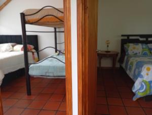 Postel nebo postele na pokoji v ubytování Hostel For Machetà Climbers Colombia