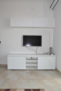 TV a/nebo společenská místnost v ubytování House with Sea View