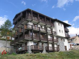 a building with balconies on the side of it at Duplex 3 chambres pour 8 pers avec jolie vue village à Aussois - FR-1-508B-16 in Aussois