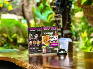 two boxes of food sitting on top of a table at Sandybridge Eco Farm at Relly's Restaurant in Puerto Princesa City
