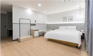 Postel nebo postele na pokoji v ubytování HOTEL bonito