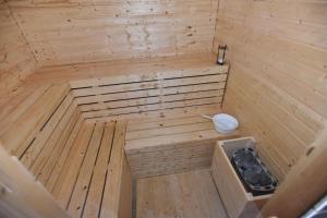 an empty wooden sauna with a toilet in it at Apartments Lapaž in Sveti Martin na Muri