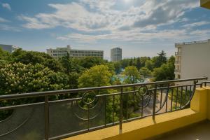 a balcony with a view of a city at Hotel Perunika in Golden Sands
