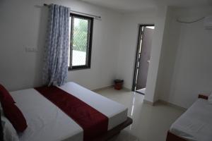 Postel nebo postele na pokoji v ubytování Hotel Shree Radhe Laxmi