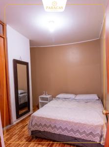 Una cama o camas en una habitación de Hostal Paracas I 7 fotos más