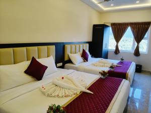 Postel nebo postele na pokoji v ubytování Hotel Sri Kanthan Residency