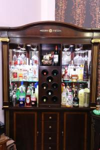 a liquor cabinet filled with lots of bottles and alcohol at Mozhu Homestay in Hualien City