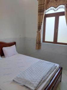Postel nebo postele na pokoji v ubytování Biệt Thự Villa Thảo Vy