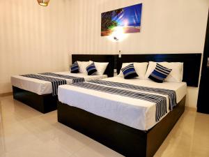 Postel nebo postele na pokoji v ubytování Sun sea guest home