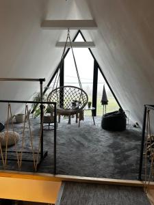 a room with a hammock in a tent at Zsóry Cabinbox in Mezőkövesd