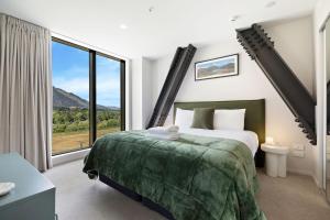 En eller flere senge i et værelse på Remarkable Retreat