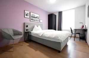Ένα ή περισσότερα κρεβάτια σε δωμάτιο στο Hotel Zugertor
