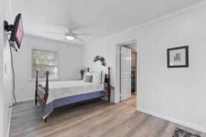 a bedroom with a bed and a ceiling fan at Little Bit Of Country in Sevierville