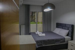 Ένα ή περισσότερα κρεβάτια σε δωμάτιο στο Samaras seaside apartment