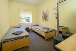 Voodi või voodid majutusasutuse Haapsalu Kutsehariduskeskuse hostel toas