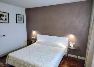 Letto o letti in una camera di Hotel Datini