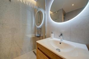 a bathroom with a sink and a mirror at Juliet Residence, Apt 4 , Your Home Away from Home in Gzira by SF HOMES in Il-Gżira +21 photos