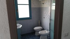 Koupelna v ubytování S'Apposentu Teuladesu Affittacamere del Ristorante da Stefano + 37 fotografií