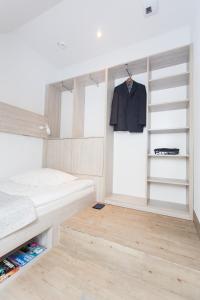 Postel nebo postele na pokoji v ubytování Studio Kampus Garnizon