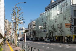 a city street with buildings and a street light at REJ Reflet Ebisu in Tokyo