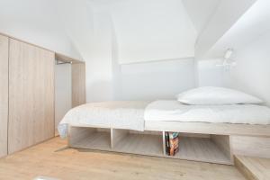 Postel nebo postele na pokoji v ubytování Studio Kampus Garnizon