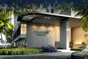 a blue car parked in front of a building at Splash Mania Maya Bay Residence Blissful Nest Gamuda Cove in Banting