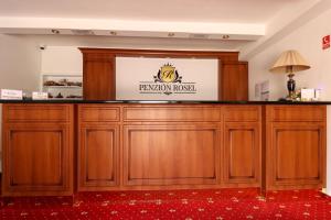 a large wooden podium with a sign on it at Penzión Rosel in Nové Zámky