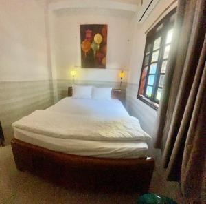 Postel nebo postele na pokoji v ubytování Serendipity Experience Hoi An Hostel