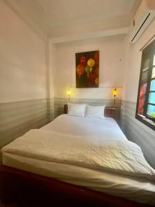 Postel nebo postele na pokoji v ubytování Serendipity Experience Hoi An Hostel