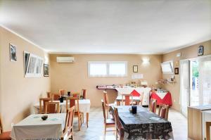 a dining room with tables and chairs in a restaurant at Zio Tonino in Termoli
